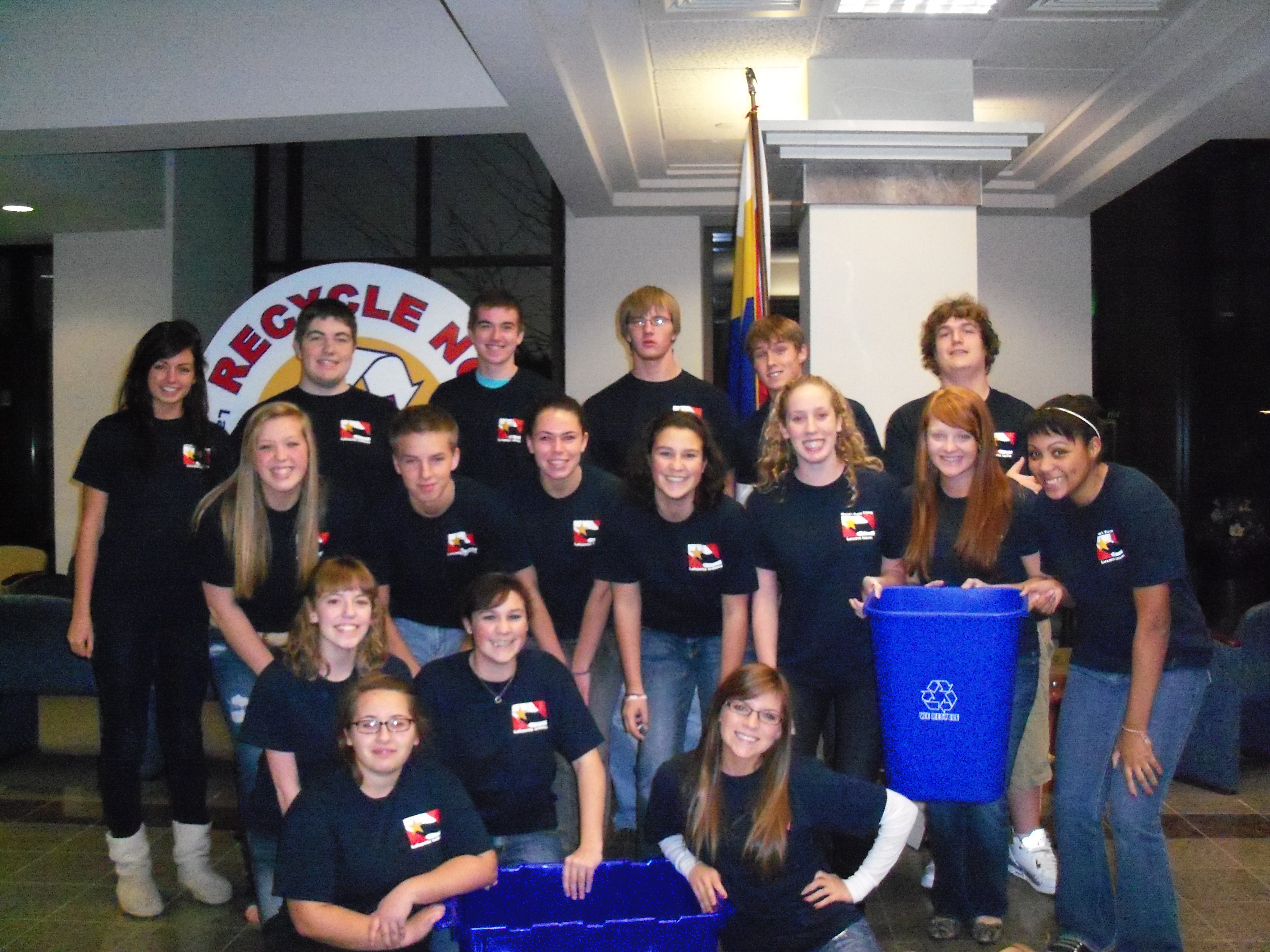 A group of teenagers in black shirts